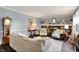Inviting living room with a fireplace, built-in bookshelves, and comfortable seating at 12669 Brookshire Pkwy, Carmel, IN 46033