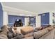 Spacious living room featuring a sectional sofa, ample seating, and a media center with a television at 12669 Brookshire Pkwy, Carmel, IN 46033