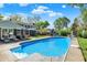 Backyard pool with diving board and attached spa offers a great outdoor retreat at 12669 Brookshire Pkwy, Carmel, IN 46033