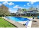 An inground pool is surrounded by lush landscaping and a spacious backyard at 12669 Brookshire Pkwy, Carmel, IN 46033