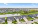 Panoramic aerial view of homes in a neighborhood surrounding a pond at 1295 Clairet Dr, Westfield, IN 46074
