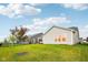 Wide backyard with green lawn and a view of the house with a covered porch at 1295 Clairet Dr, Westfield, IN 46074