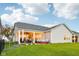 Spacious backyard with covered patio, hot tub, and well-maintained lawn at 1295 Clairet Dr, Westfield, IN 46074