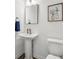 A charming bathroom features a pedestal sink, classic mirror, and tasteful decor at 1295 Clairet Dr, Westfield, IN 46074