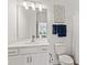 Bright bathroom features a modern vanity, a framed mirror, and stylish fixtures at 1295 Clairet Dr, Westfield, IN 46074
