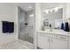 Modern bathroom featuring a glass enclosed marble tiled shower, dual sinks, and quartz countertops at 1295 Clairet Dr, Westfield, IN 46074