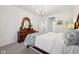 Relaxing bedroom features soft carpet, a carved wood bed frame, and neutral decor at 1295 Clairet Dr, Westfield, IN 46074