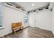 A bonus room with hardwood flooring, natural lighting, sports equipment, and a wooden bench at 1295 Clairet Dr, Westfield, IN 46074