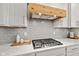 Updated kitchen showcasing marble countertops, a subway tile backsplash, and modern appliances at 1295 Clairet Dr, Westfield, IN 46074