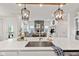 Open-concept kitchen features a large island with a sink, stainless steel appliances, and views into a living room at 1295 Clairet Dr, Westfield, IN 46074