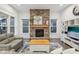 Bright living room with stone fireplace, neutral furniture and decor at 1295 Clairet Dr, Westfield, IN 46074