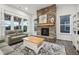 Inviting living room with a stone fireplace and large windows for natural light at 1295 Clairet Dr, Westfield, IN 46074