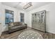Comfortable living room features a gray sofa, wood floors, modern light fixture, and lovely china cabinet at 1295 Clairet Dr, Westfield, IN 46074