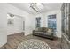 Cozy living room showcases wood floors, a stylish rug, a comfortable gray sofa, and natural light at 1295 Clairet Dr, Westfield, IN 46074