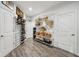 Spacious walk-in closet with hardwood floors, shelving, storage baskets, and shoe racks at 1295 Clairet Dr, Westfield, IN 46074