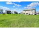 Large backyard featuring lush green lawn and neighboring homes in a suburban community at 12951 Corydon Dr, Fishers, IN 46037