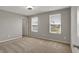 Bright bedroom with two windows providing natural light, neutral walls and neutral carpet at 12951 Corydon Dr, Fishers, IN 46037