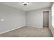 A bedroom featuring neutral walls, carpet, trim and a ceiling fan light, creating a serene and comfortable atmosphere at 12951 Corydon Dr, Fishers, IN 46037