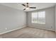 Light-filled bedroom with a large window and neutral carpet at 12951 Corydon Dr, Fishers, IN 46037