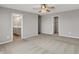 Large carpeted bedroom with ceiling fan with access to a bathroom and closet, ideal for comfort and convenience at 12951 Corydon Dr, Fishers, IN 46037