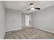 Neutral bedroom with a ceiling fan, gray walls and neutral carpet at 12951 Corydon Dr, Fishers, IN 46037