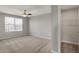 Comfortable bedroom with a ceiling fan, a window for natural light, and a closet at 12951 Corydon Dr, Fishers, IN 46037