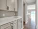 Close-up of countertops featuring modern cabinets with sleek, black hardware at 12951 Corydon Dr, Fishers, IN 46037