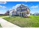 Inviting two-story home with lush green lawn, driveway, and a welcoming front entrance at 12951 Corydon Dr, Fishers, IN 46037
