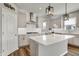 Modern kitchen with an island, recessed lighting, and elegant countertops at 12951 Corydon Dr, Fishers, IN 46037