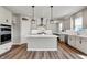 Bright kitchen boasts a center island, modern appliances, and sleek cabinetry at 12951 Corydon Dr, Fishers, IN 46037