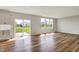 Bright and airy living room with wood floors and sliding glass doors leading to the outdoor area at 12951 Corydon Dr, Fishers, IN 46037