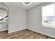 Room with hardwood flooring and staircase in view at 12951 Corydon Dr, Fishers, IN 46037