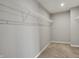 Bright, carpeted walk-in closet with white wire shelving for ample storage at 12951 Corydon Dr, Fishers, IN 46037