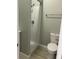 Bathroom featuring a standing shower with a chrome shower head, toilet, and towel rack at 1342 W Lee St, Indianapolis, IN 46221