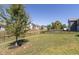 This backyard features a large grassy area, perfect for outdoor activities and relaxation at 1370 Timber Bluff Rd, Westfield, IN 46074