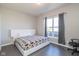 Well-lit bedroom features a modern bed frame, ample natural light, and neutral decor at 1370 Timber Bluff Rd, Westfield, IN 46074