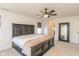 Large bedroom features a dark wood bed frame, ceiling fan, and ample natural light at 1370 Timber Bluff Rd, Westfield, IN 46074