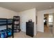 This bedroom includes bunk beds, a dresser, shelving and neutral decor for a serene space at 1370 Timber Bluff Rd, Westfield, IN 46074