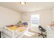 This bedroom offers a whimsical heart mirror, a cozy bed and natural light from the window at 1370 Timber Bluff Rd, Westfield, IN 46074