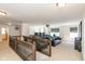 This bonus room features a home theater setup with reclining seats and a projector at 1370 Timber Bluff Rd, Westfield, IN 46074
