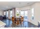 Bright dining area with sliding doors to patio, round table, and view of the nearby living spaces at 1370 Timber Bluff Rd, Westfield, IN 46074