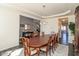 Spacious dining room with a long wooden table, comfortable seating, and hardwood floors at 1370 Timber Bluff Rd, Westfield, IN 46074