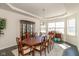 Formal dining room features a large buffet table, glass display case, and natural light at 1370 Timber Bluff Rd, Westfield, IN 46074