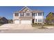 Two-story home with a three car garage, brick accents and manicured lawn at 1370 Timber Bluff Rd, Westfield, IN 46074