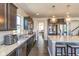 Modern kitchen with granite countertops, stainless steel appliances, and dark wood cabinets at 1370 Timber Bluff Rd, Westfield, IN 46074