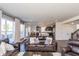 Open-concept living room with stylish furniture and hardwood floors leading to a modern kitchen at 1370 Timber Bluff Rd, Westfield, IN 46074