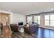 Open-concept living room featuring hardwood floors, modern furnishings and neutral paint at 1370 Timber Bluff Rd, Westfield, IN 46074