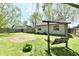 Spacious backyard featuring a swing set and a mix of grassy and gravel areas at 1472 Maria Ave, Franklin, IN 46131