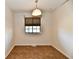 Empty dining space with neutral walls, a window, and modern flooring at 1472 Maria Ave, Franklin, IN 46131
