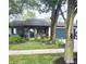 Charming single-story home featuring a well-maintained lawn, mature trees, and a blue two-car garage at 1472 Maria Ave, Franklin, IN 46131